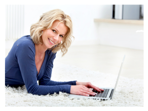 Woman on her laptop smiling