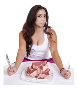 Woman eating steak