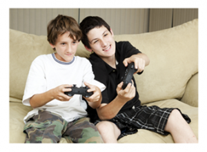 Boys playing video games together