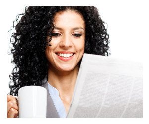 Woman Reading the News with Coffee