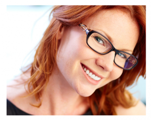 Smiling Woman Red Hair and Glasses