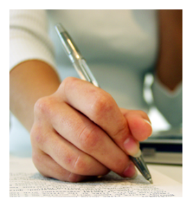 Woman writing with a pen