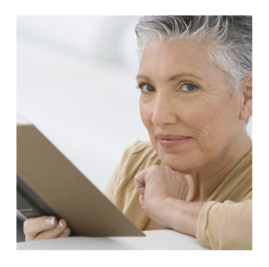 Mature Woman Reading a Book and Smiling