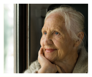 Lovely Older Woman Looking Out Window