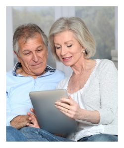 Mature Couple Reading Together on the Internet