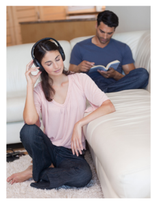 Man Reading Woman Listening to Music