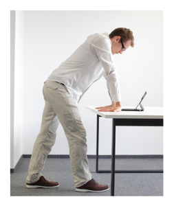 Man Flexing Wrists Standing at Desk