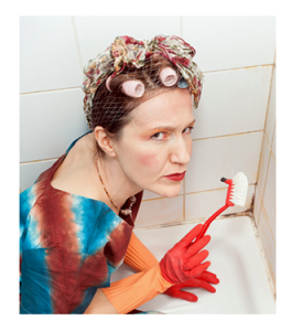 Scowling Woman Scrubbing Bathtub