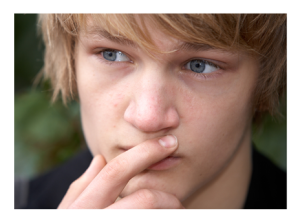 Teenage Boy Lost in Thought