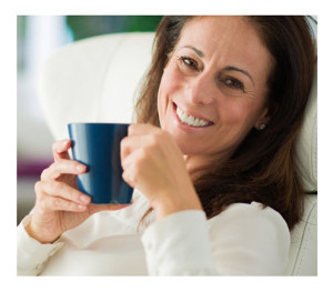 Woman Drinking Coffee Smiling