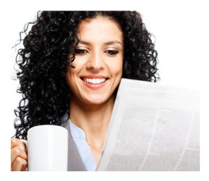 Woman Reading Newspaper with Coffee