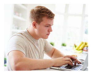 Young Man at Home on Laptop