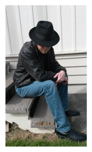 Man in Fedora on Stoop