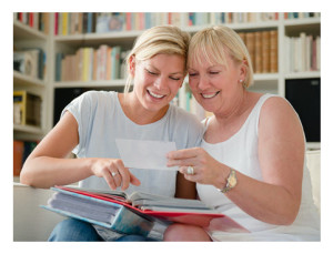 Mother and Daughter looking at photo album