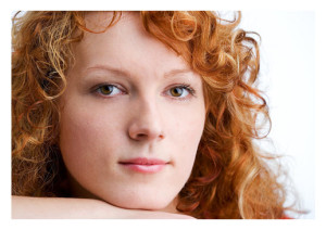 Pensive Woman with Red Hair