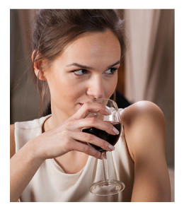 Flirty Woman Sipping Red Wine
