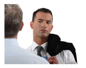 Man Looking Suspiciously at Co-Worker