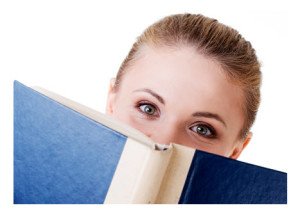 Woman Peering Over Open Book