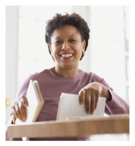 Smiling African American Woman Holding Bills