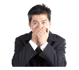 Businessman Covering His Mouth