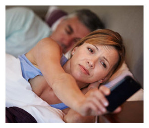 Couple in Bed_Man Asleep_Woman Waking Up