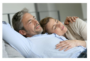 Mature Couple Relaxing on Sofa