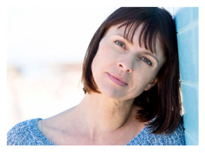 Thoughtful woman in blue sweater