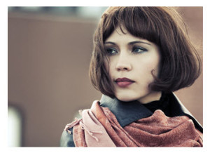 Pensive Young Woman in Scarf