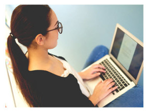 Young Woman Typing on a Laptop_Daily Plate of Crazy