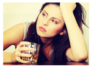 Depressed Young Woman With Alcohol
