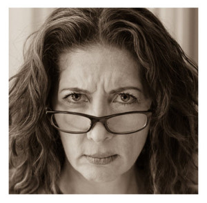 Middle Age Woman Stern Face With Glasses