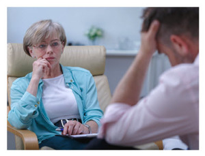 Therapist Listening to Male Patient