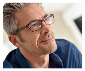 Handsome Mature Man in Glasses Thinking