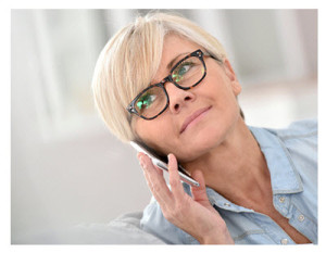 Midlife Woman Wearing Glasses With Smartphone