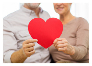 Mature Couple Holding a Valentine