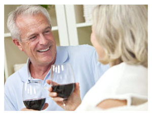 happy-midlife-couple-sharing-talk-and-wine